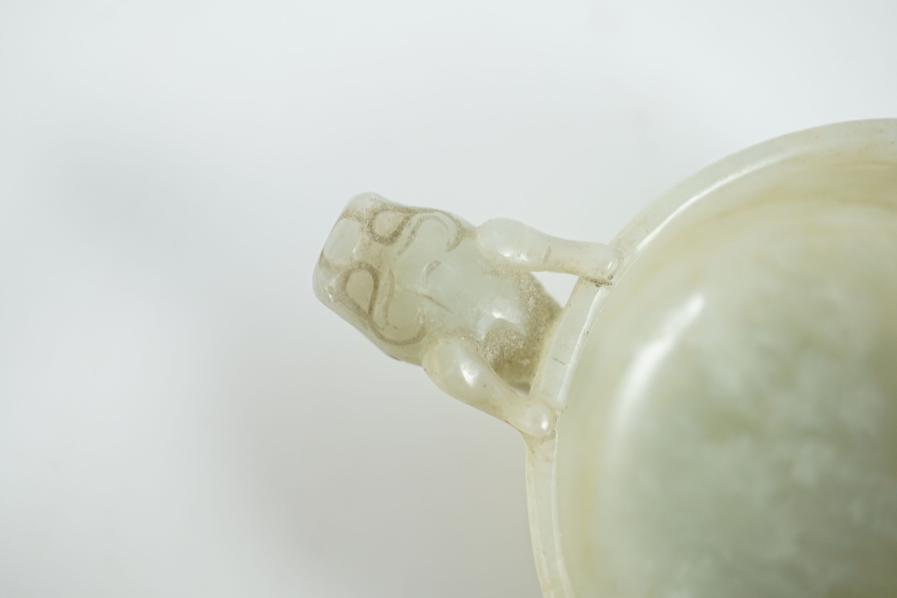 A Chinese pale celadon jade two handled ‘chilong’ cup, 17th/18th century, 13.2cm wide